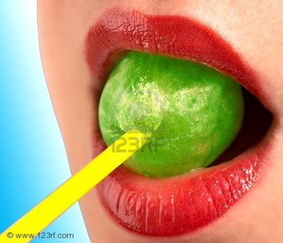 1525153_the_girl_with_red_lips_sucks_a_green_sweet.jpg