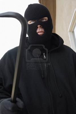 3540783_man_wearing_balaclava_and_holding_crowbar.jpg