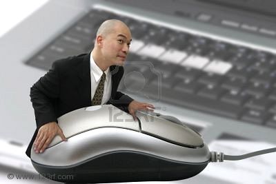 509130_man_with_giant_mouse_and_computer_in_background.jpg