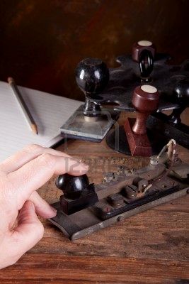 6700430_hand_tapping_morse_code_on_an_antique_telegraph_machine.jpg