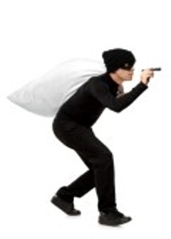 7776148_thief_carrying_a_bag_and_holding_a_torch_isolated_against_white_background.jpg
