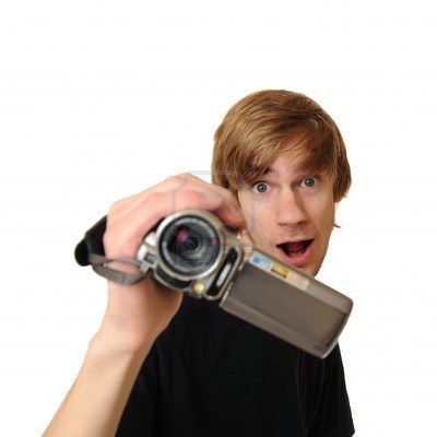 8750371_young_adult_man_holding_an_hd_camcorder_isolated_on_white_background.jpg