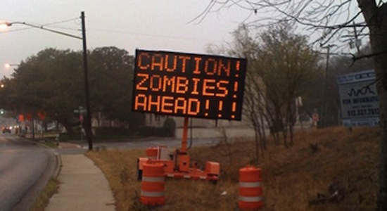 Caution_Zombies_Ahead_Road_Sign.jpeg