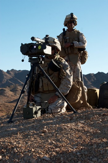 Defensegov_News_Photo_101006_M_8399S_035___US_Marine_Cpl_Mark_A_Tirona_sets_a_portable_laser_designator_rangefinder_onto_a_target_as_Pfc_Daquaruis_Abner_listens_for_range_control_on_a.jpg