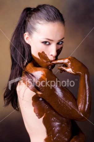 istockphoto_5131480_woman_covered_in_melted_chocolate_and_licking_finger.jpg