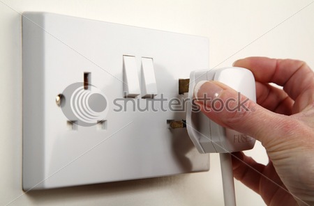 stock_photo_uk_plug_about_to_be_plugged_into_a_white_wall_socket_3546924.jpg